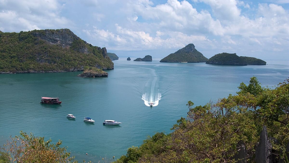 Boats anchored in a bay between the islands of Ang Thong
